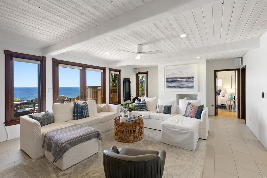 1370 Neptune Avenue Encinitas, CA 92024 - Photo 26 of 31 a living room with furniture and a large window