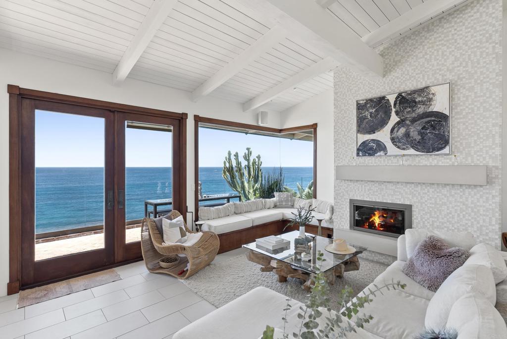 1370 Neptune Avenue Encinitas, CA 92024 - Photo 4 of 31 a living room with furniture and a fireplace