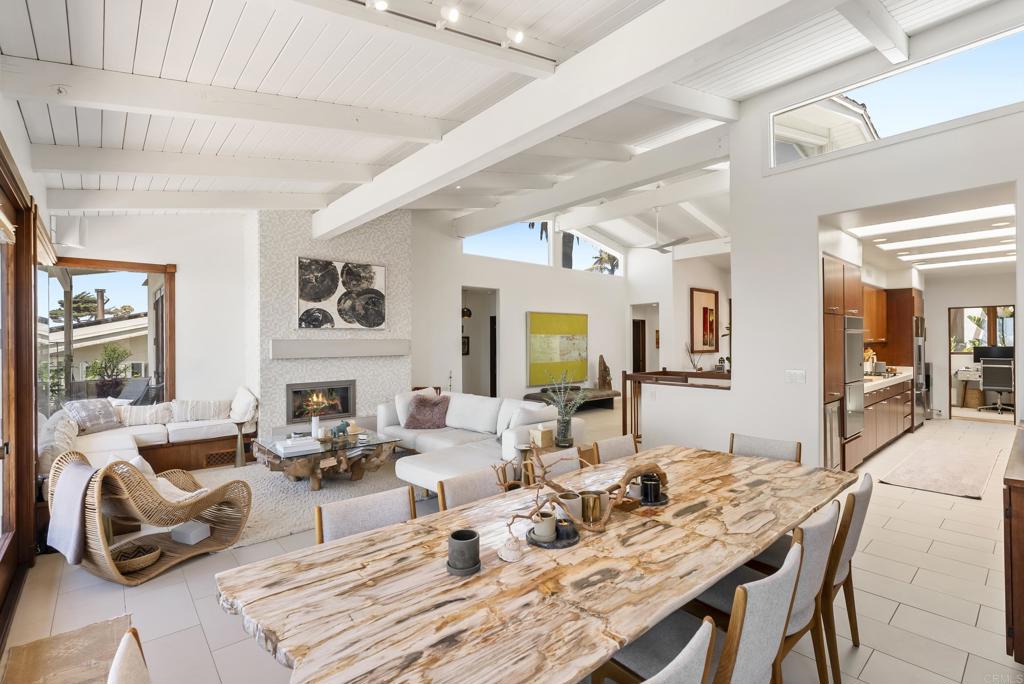 1370 Neptune Avenue Encinitas, CA 92024 - Photo 6 of 31 a living room with fireplace furniture and a large window