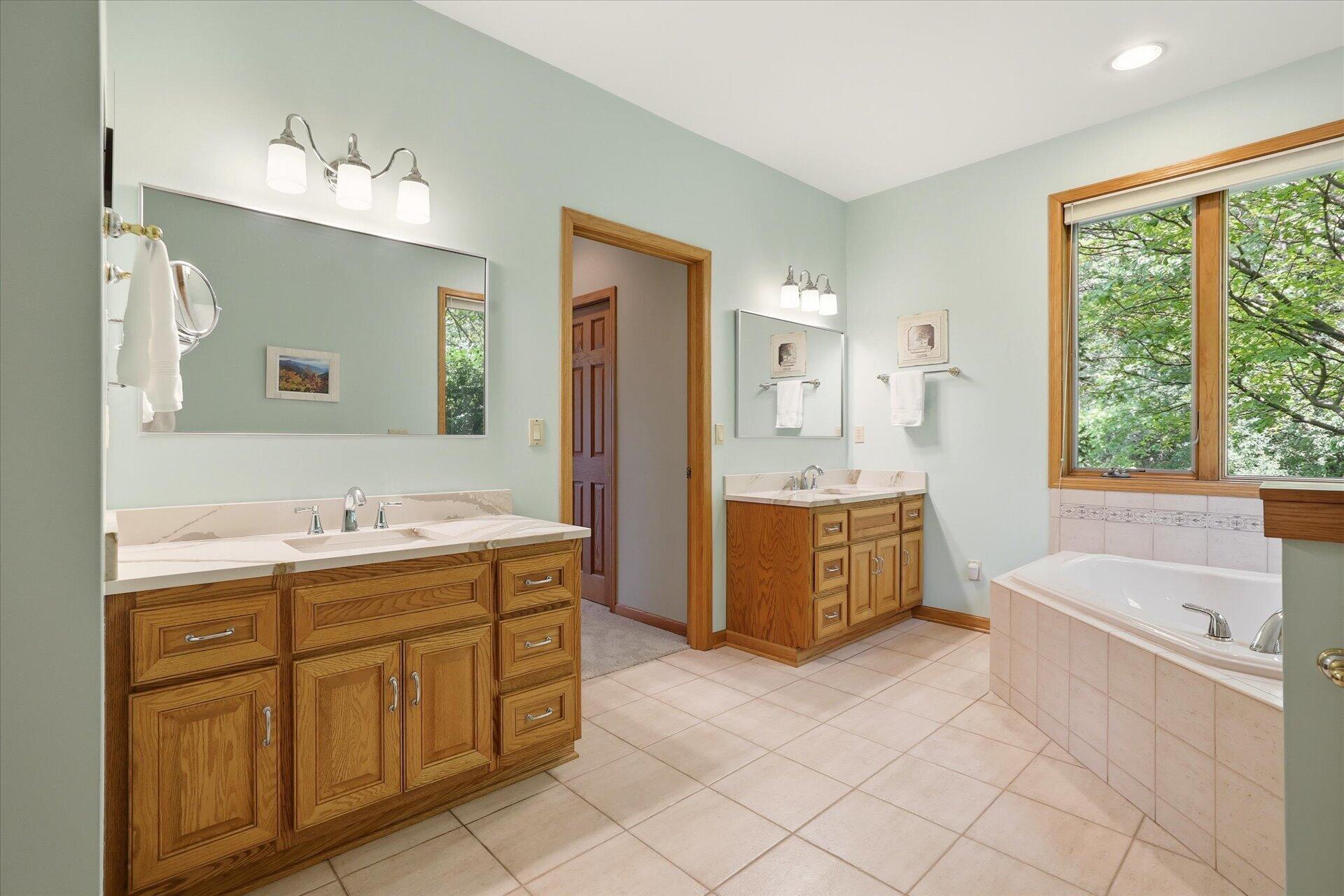 W330-s1417 County Rd C Delafield, WI 53018 - Photo 17 of 39 Dual vanities, soaking tub, & walk-in shower