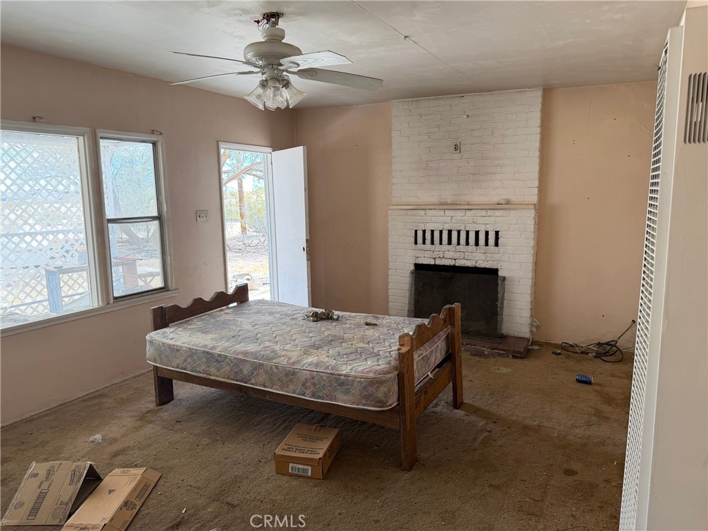 6316 Isleta Road Twentynine Palms, CA 92277 - Photo 2 of 13 a bed sitting in a room next to a window