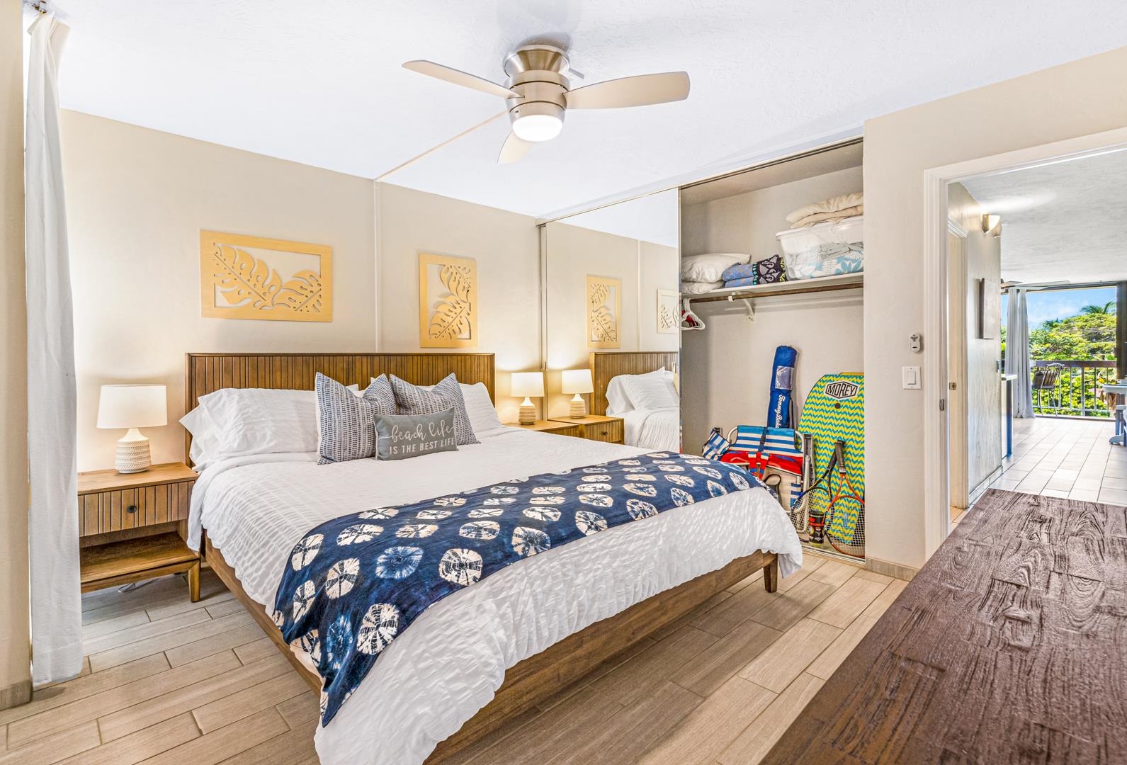 2191 South Kihei Road, Unit 1305 Kihei, HI 96753 - Photo 16 of 21 a bedroom with a bed and wooden floor