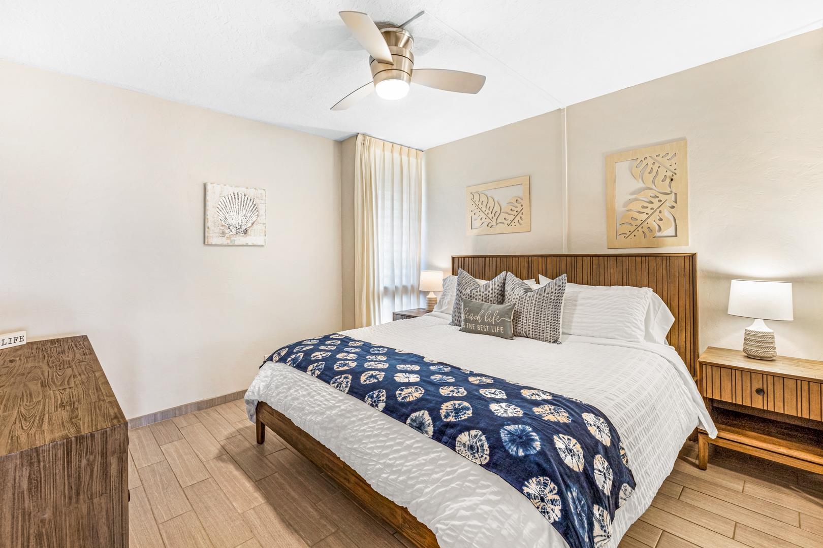 2191 South Kihei Road, Unit 1305 Kihei, HI 96753 - Photo 17 of 21 a bedroom with a bed lamp and a window