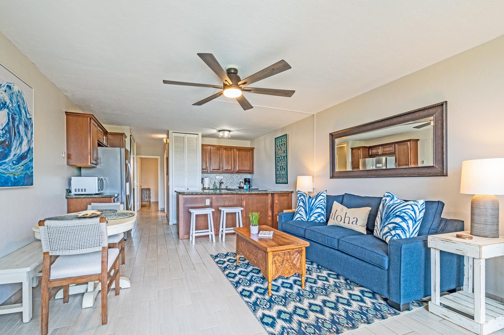 2191 South Kihei Road, Unit 1305 Kihei, HI 96753 - Photo 5 of 21 a living room with furniture and a wooden floor