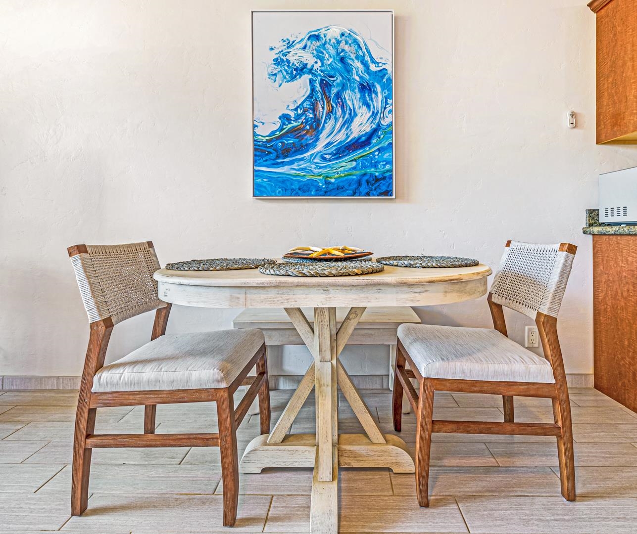 2191 South Kihei Road, Unit 1305 Kihei, HI 96753 - Photo 7 of 21 a view of a dining room with furniture and wooden floor