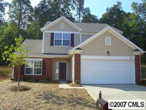 321 Rook Road Charlotte, NC 28216 - Photo 1 of 1 a front view of a house with a yard and garage