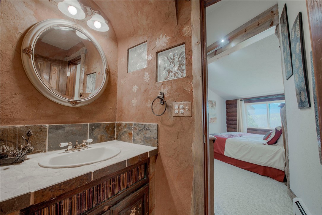 9460 Ryan Gulch Road, Unit 60 Silverthorne, CO 80498 - Photo 19 of 34 Upstairs guest bathroom