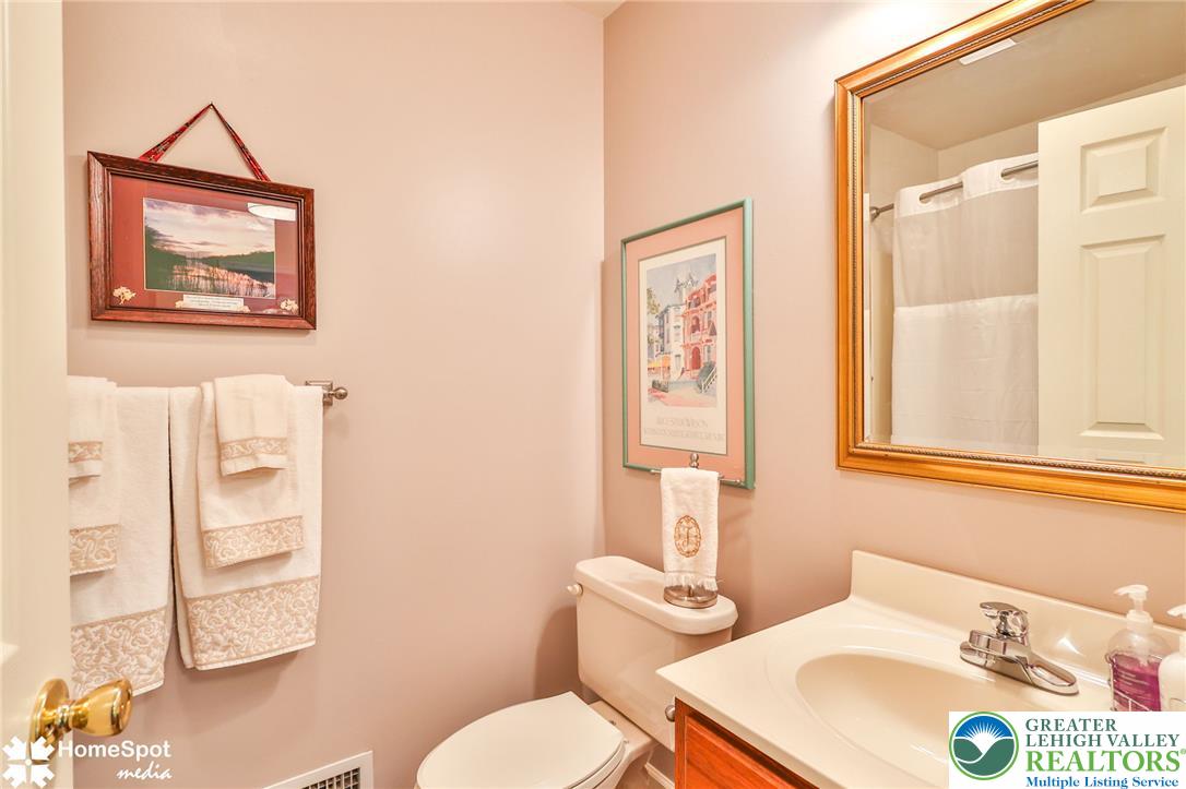 4191 Walter Road Bethlehem, PA 18020 - Photo 14 of 23 A well-appointed lavatory with a vanity sink and shower, offering functional convenience.