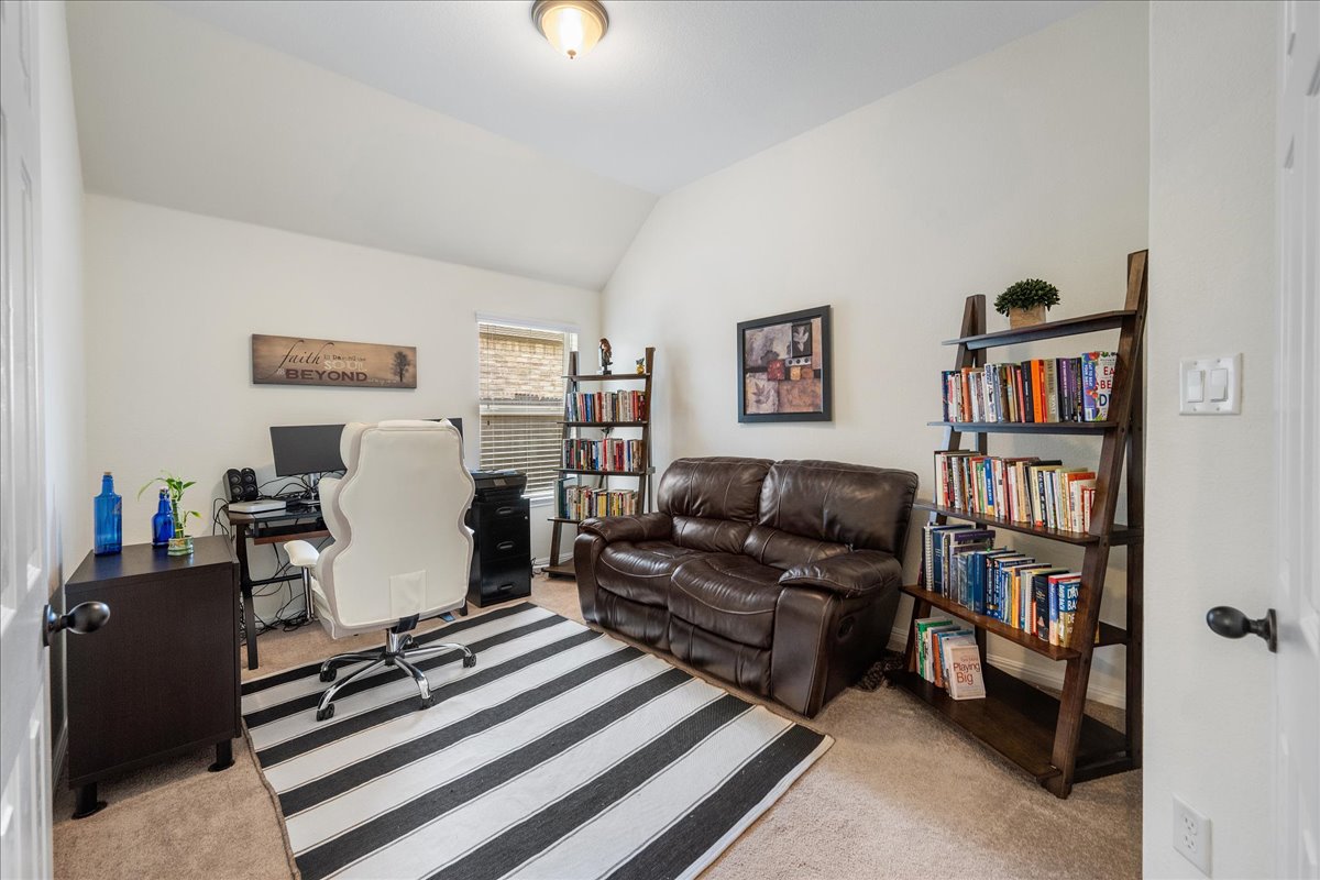 3000 Rio Verde Drive Leander, TX 78641 - Photo 9 of 23 a living room with furniture and a book shelf