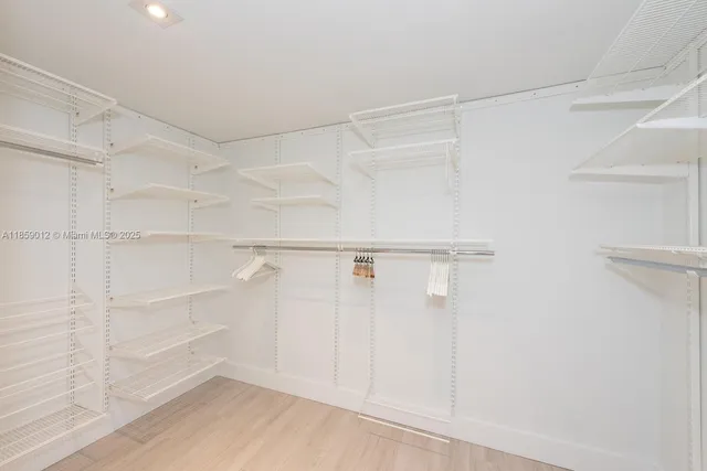 a view of an empty walk in closet