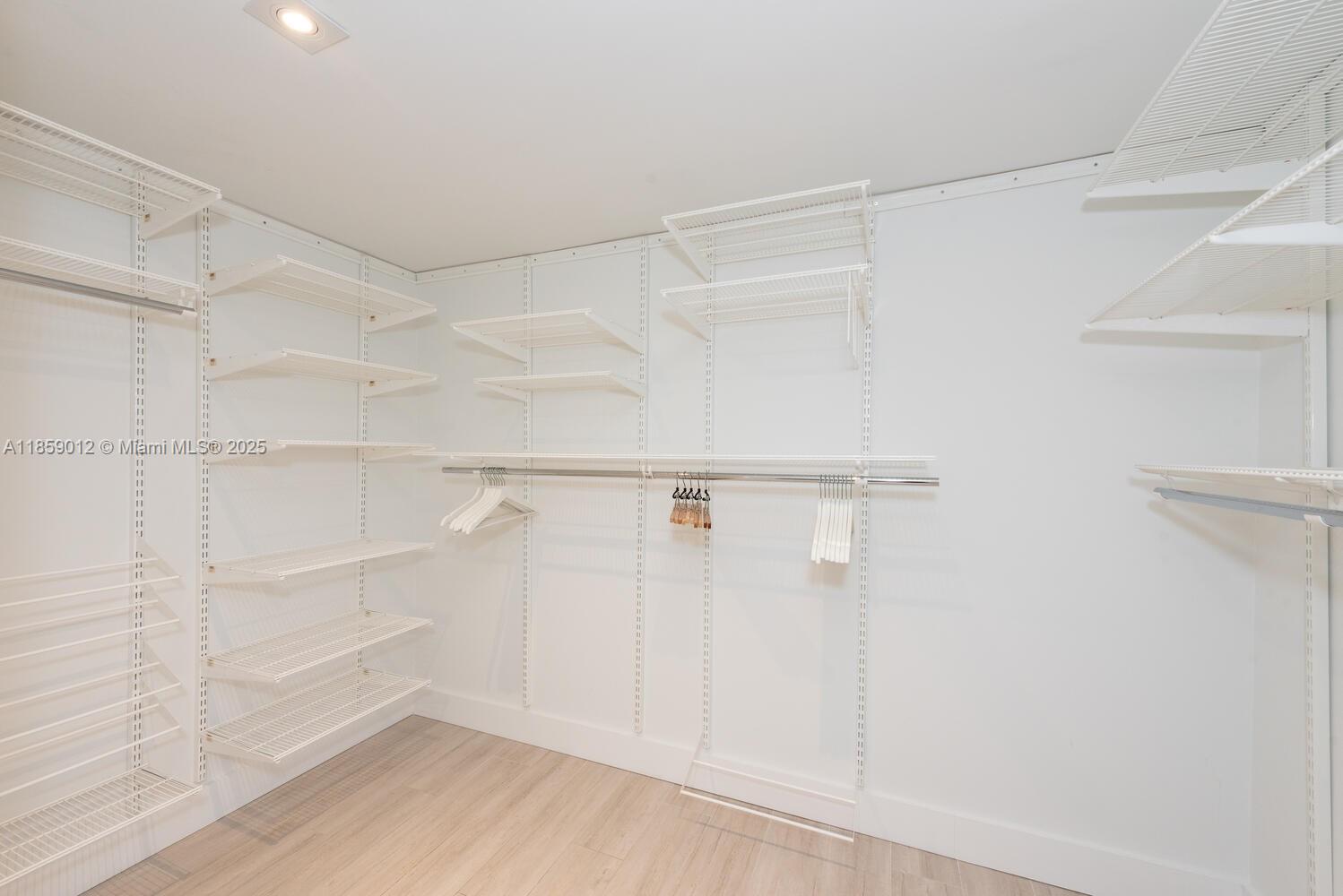 181 Crandon Boulevard, Unit 306 Key Biscayne, FL 33149 - Photo 14 of 25 a view of an empty walk in closet