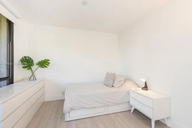 a white and white house with a bathtub