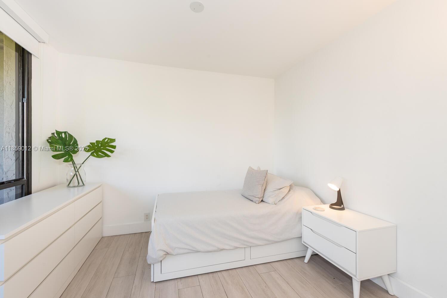 181 Crandon Boulevard, Unit 306 Key Biscayne, FL 33149 - Photo 23 of 25 a white and white house with a bathtub