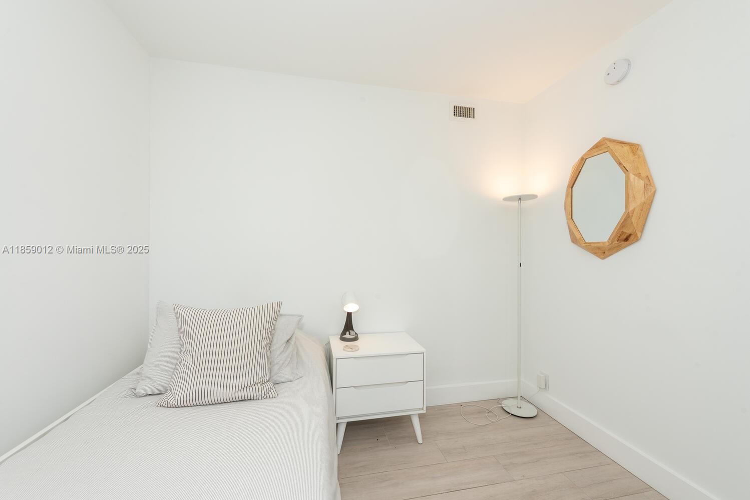 181 Crandon Boulevard, Unit 306 Key Biscayne, FL 33149 - Photo 24 of 25 a bathroom with a sink and a mirror