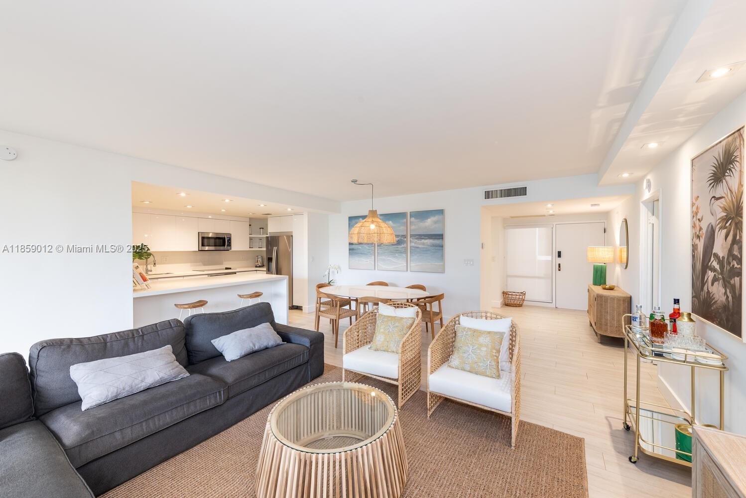 181 Crandon Boulevard, Unit 306 Key Biscayne, FL 33149 - Photo 3 of 25 a living room with furniture and a view of living room