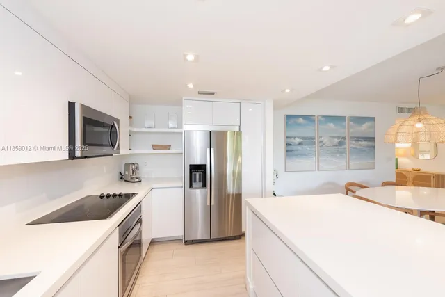 a kitchen with a sink a stove and refrigerator