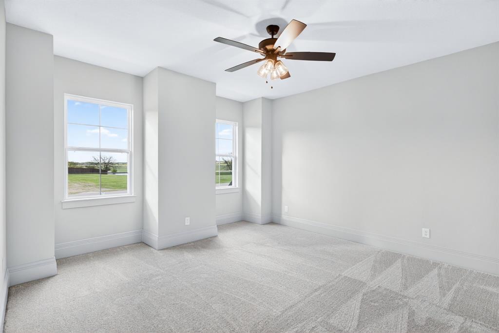 7798 Barber Rnch Road Fort Worth, TX 76126 - Photo 28 of 40 an empty room with windows and fan