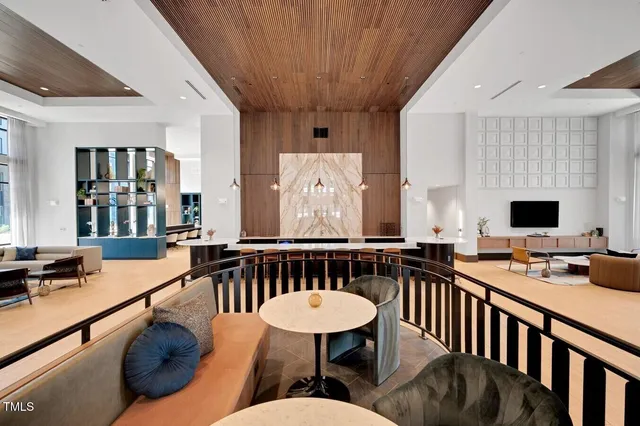 a kitchen with a table chairs stove and cabinets