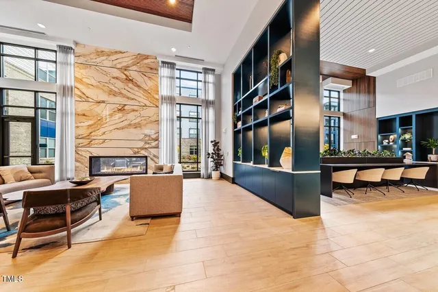 a living room with furniture and a large window