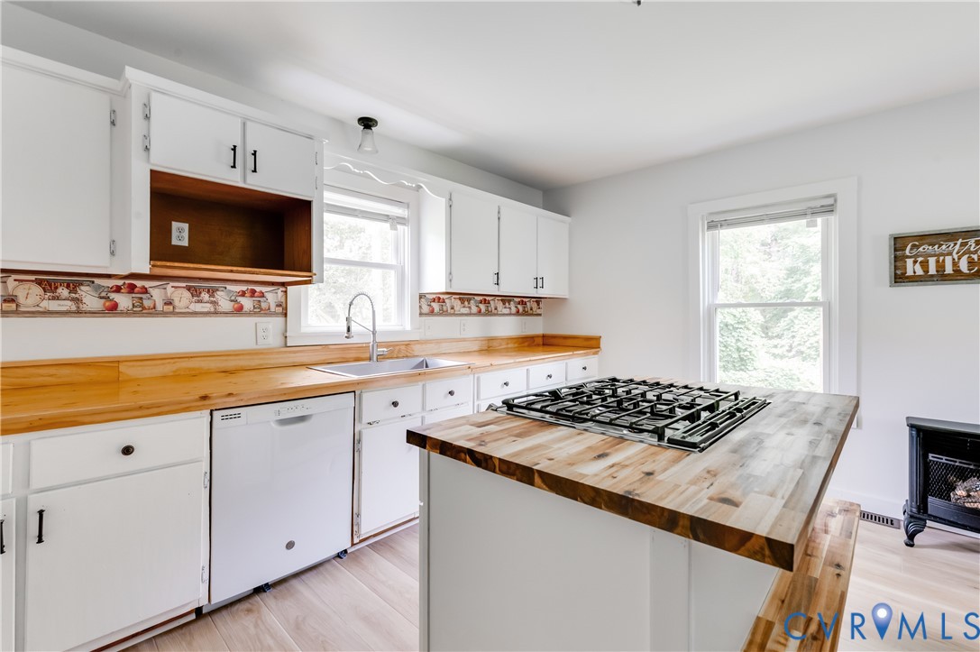 661 CCC Road Crewe, VA 23930 - Photo 13 of 38 Kitchen featuring white cabinetry, wood-finish cou