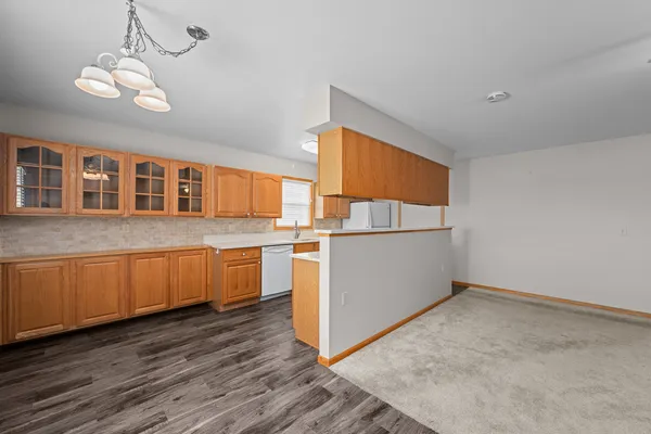 a kitchen with stainless steel appliances granite countertop a sink and cabinets