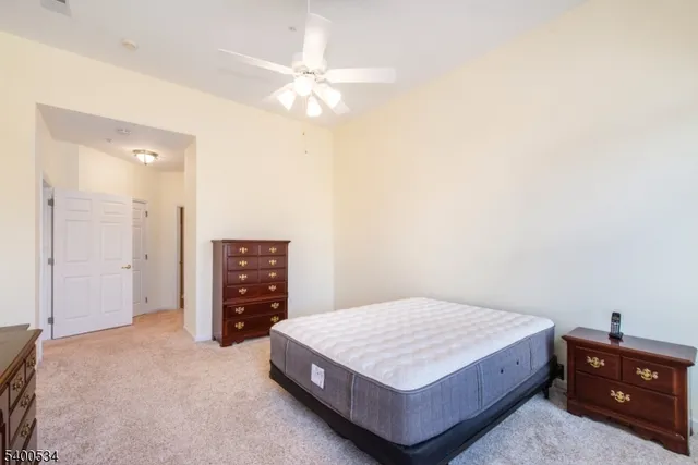 a bedroom with a bed and a cabinets
