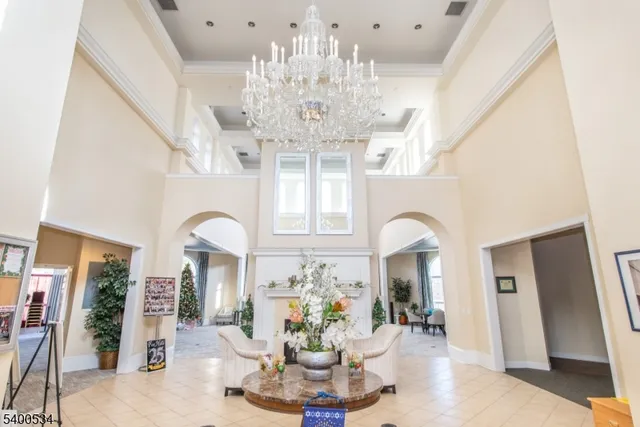 a view of a hallway with a chandelier