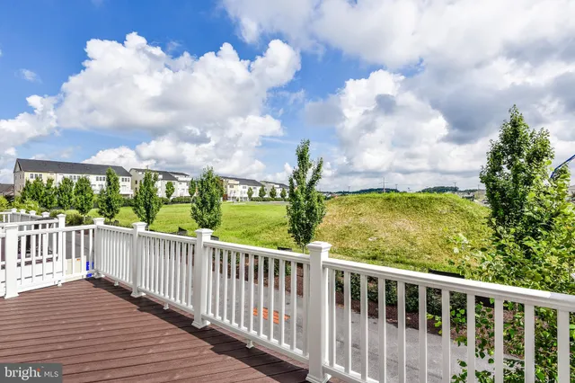 a view of a balcony with wooden floor