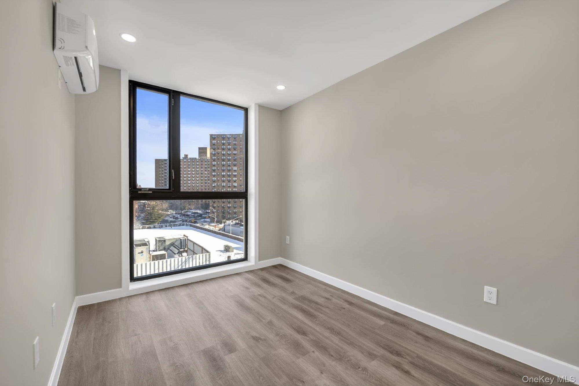 55-40 97th Place Queens, NY 11368 - Photo 9 of 11 a view of a hallway with wooden floor and a fireplace
