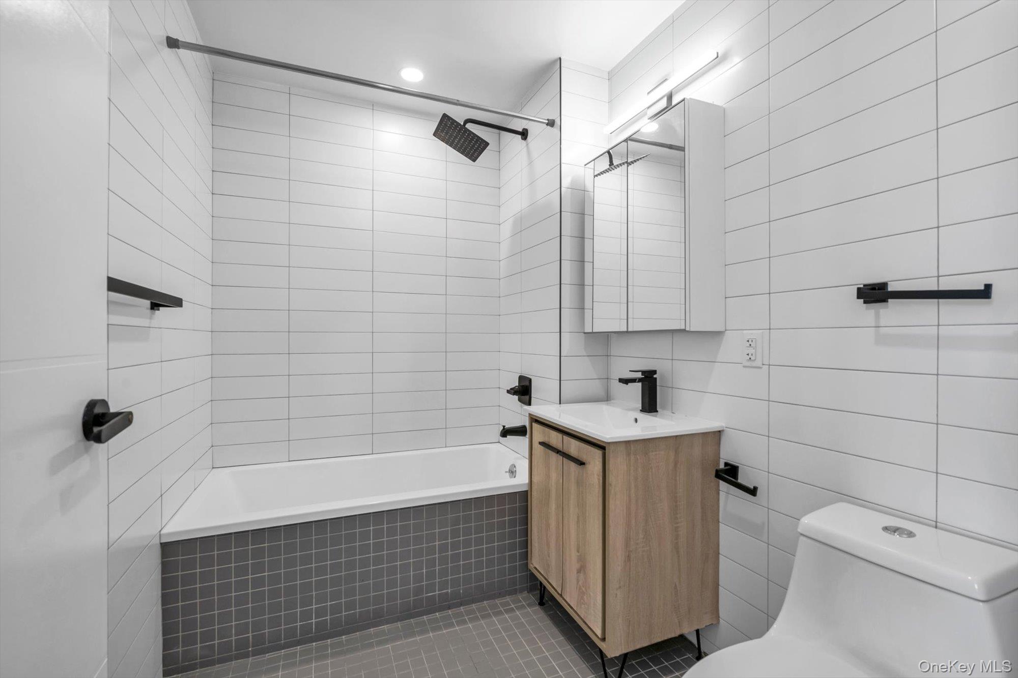 55-40 97th Place Queens, NY 11368 - Photo 10 of 11 a bathroom with a sink toilet and shower