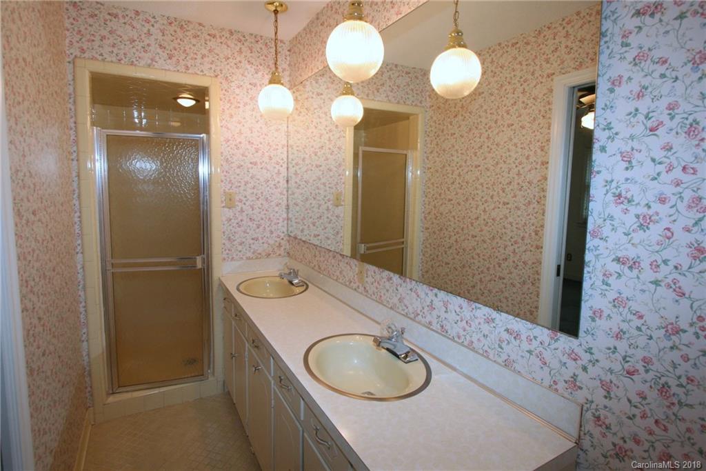 265 State Rd S-29-804 Indian Land, SC 29707 - Photo 15 of 25 a bathroom with a sink vanity granite and a mirror