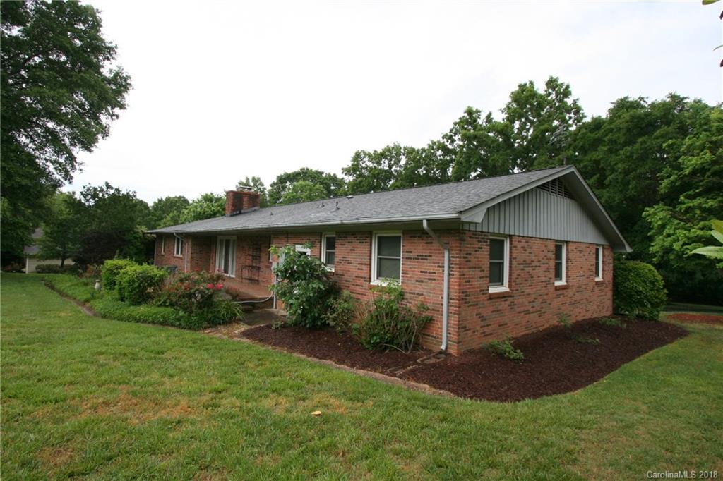 265 State Rd S-29-804 Indian Land, SC 29707 - Photo 24 of 25 a view of backyard of a house with plants and large tree