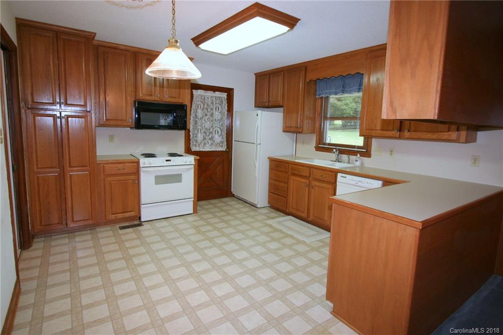 265 State Rd S-29-804 Indian Land, SC 29707 - Photo 7 of 25 a kitchen with stainless steel appliances a stove sink and microwave