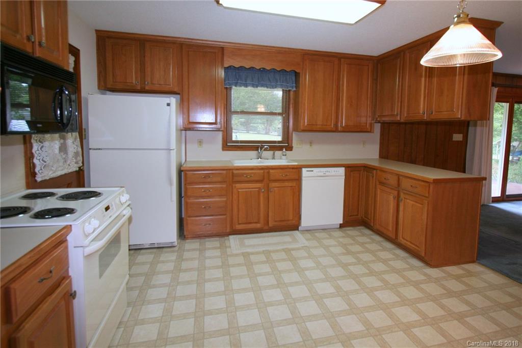 265 State Rd S-29-804 Indian Land, SC 29707 - Photo 8 of 25 a kitchen with stainless steel appliances granite countertop a stove sink and cabinets