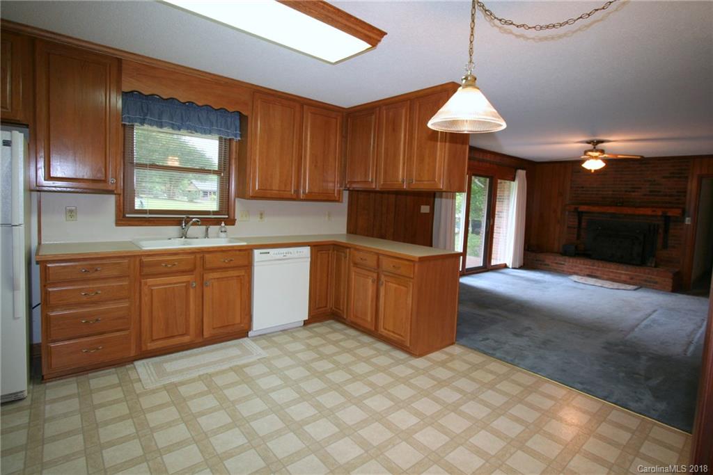 265 State Rd S-29-804 Indian Land, SC 29707 - Photo 9 of 25 a kitchen with stainless steel appliances granite countertop a stove a sink and a refrigerator