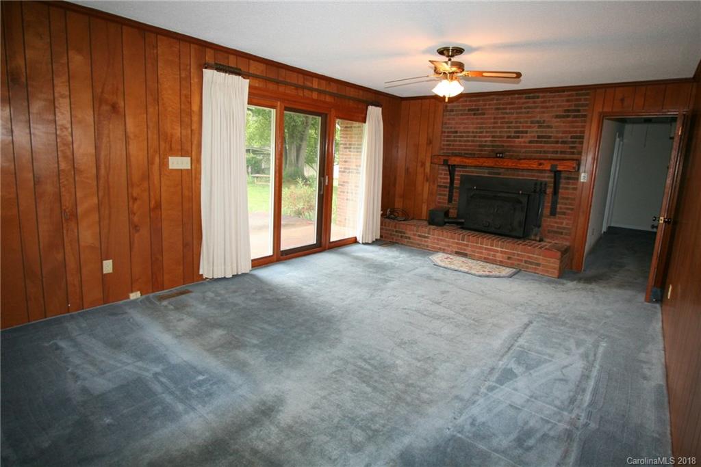 265 State Rd S-29-804 Indian Land, SC 29707 - Photo 10 of 25 a view of an empty room with a fireplace and a window