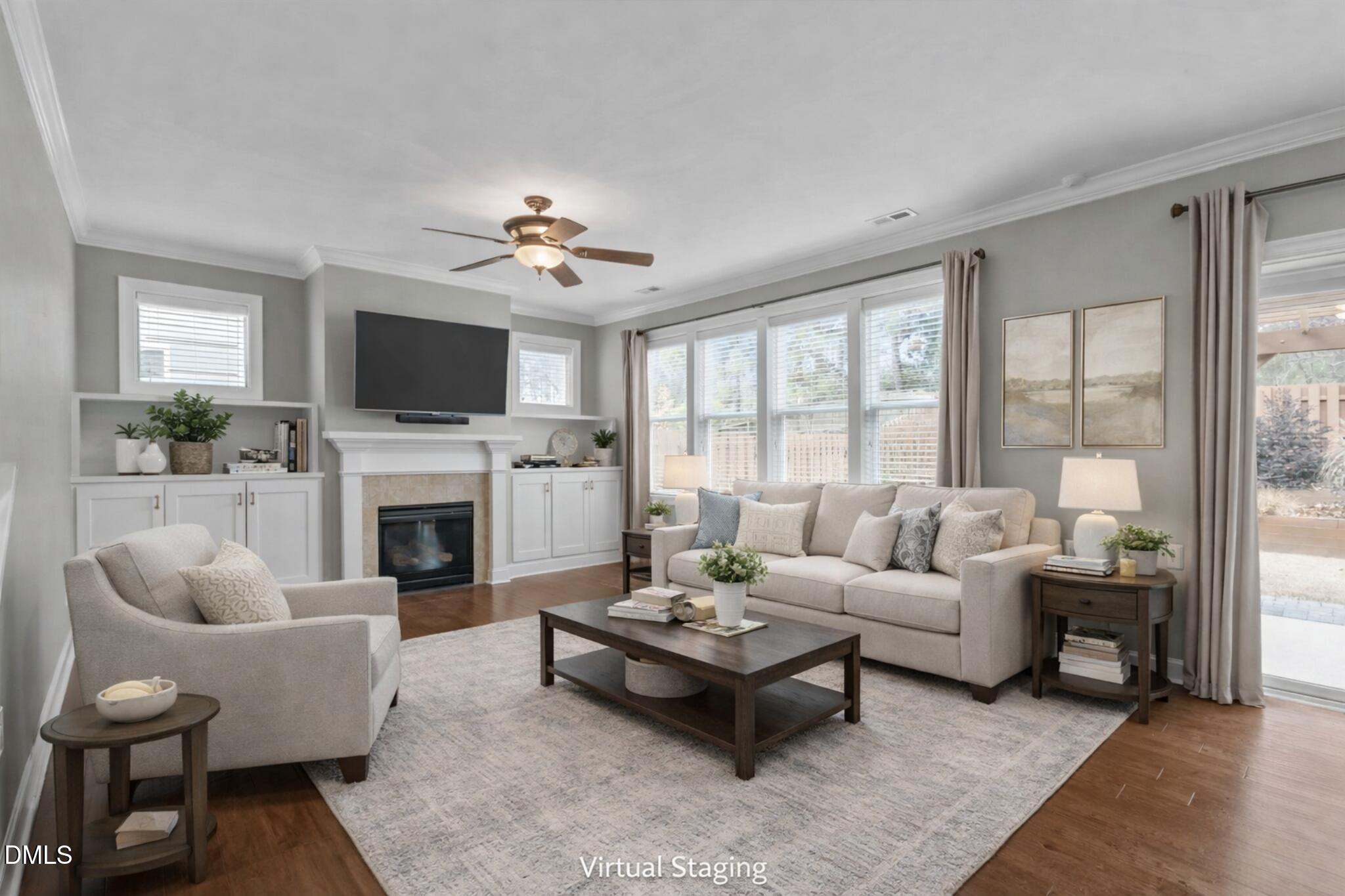 2844 Bogle Branch Court Raleigh, NC 27606 - Photo 11 of 54 a living room with furniture a fireplace and a flat screen tv