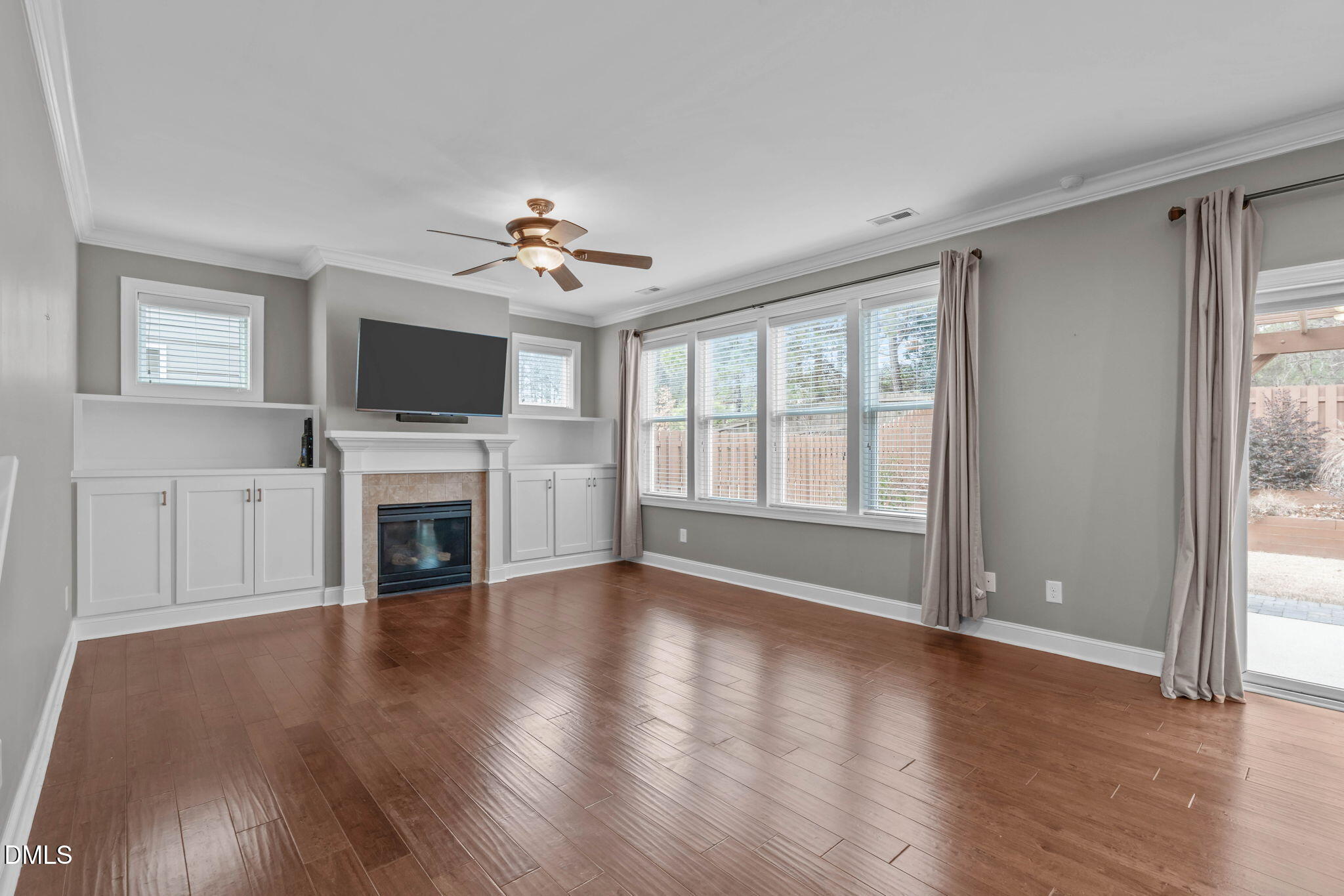 2844 Bogle Branch Court Raleigh, NC 27606 - Photo 14 of 54 a view of empty room with fireplace and wooden floor