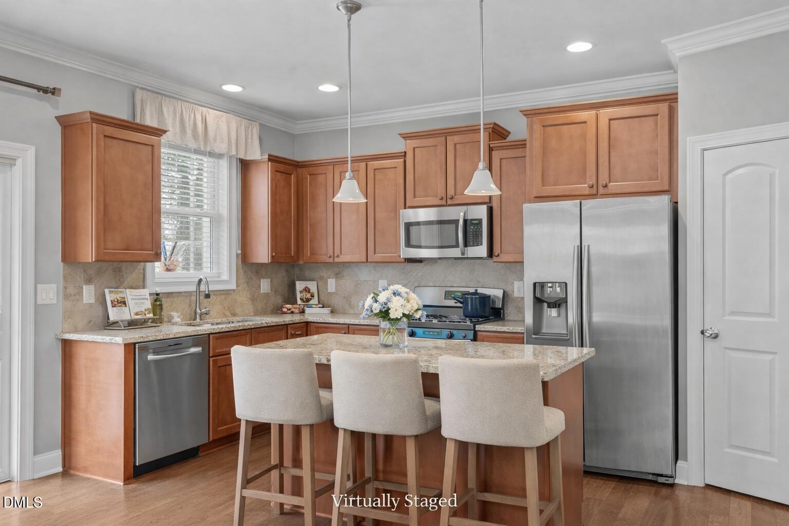 2844 Bogle Branch Court Raleigh, NC 27606 - Photo 16 of 54 a kitchen with stainless steel appliances a sink stove and refrigerator