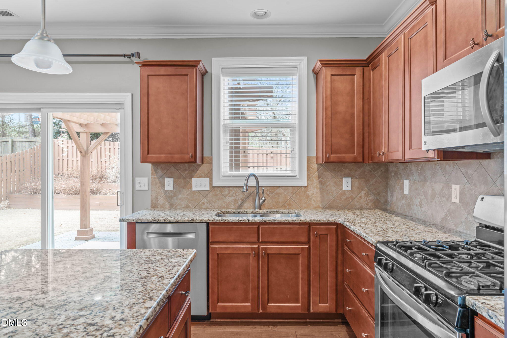 2844 Bogle Branch Court Raleigh, NC 27606 - Photo 17 of 54 a kitchen with stainless steel appliances granite countertop a stove a sink and a microwave