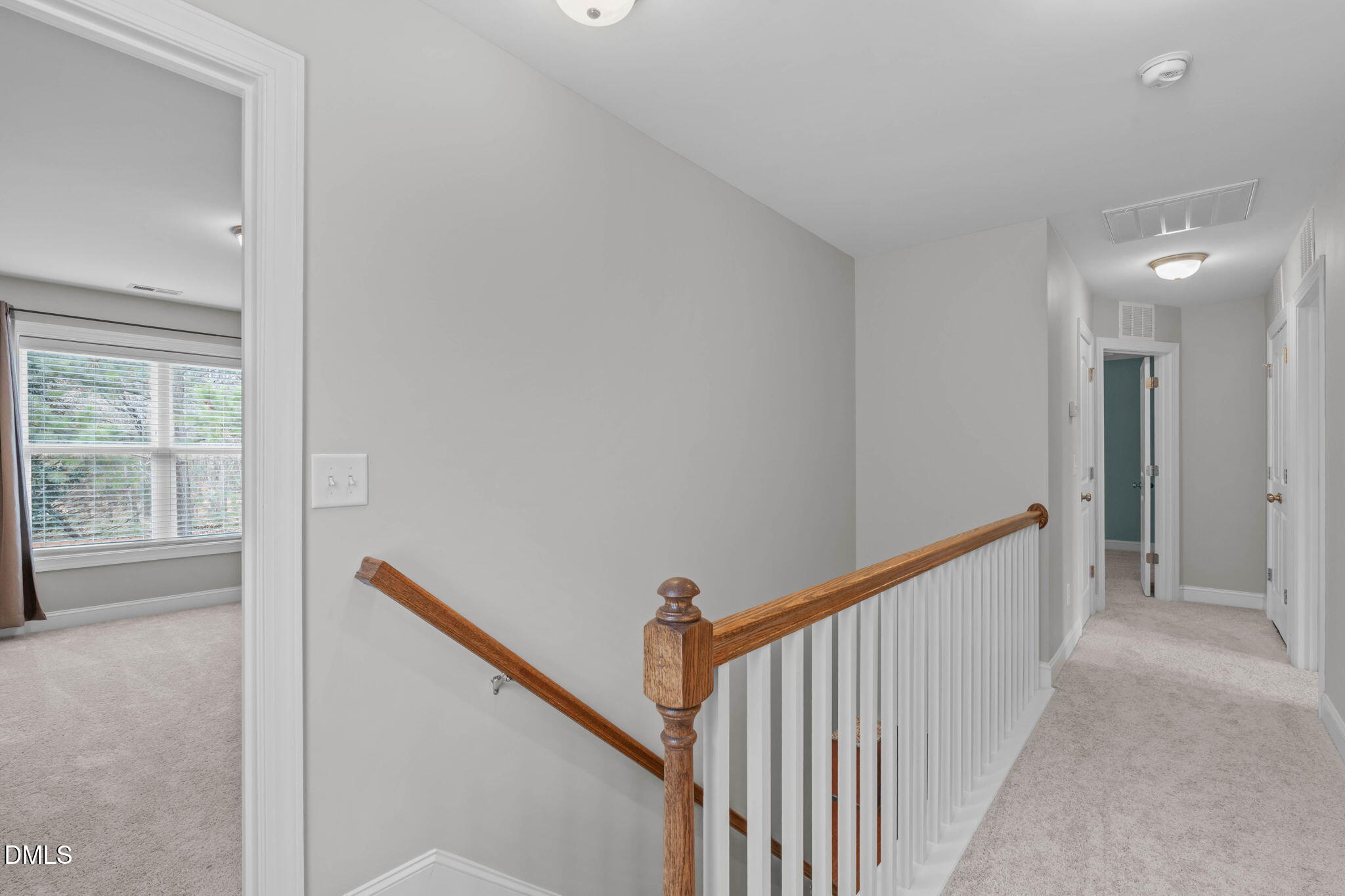 2844 Bogle Branch Court Raleigh, NC 27606 - Photo 21 of 54 a view of a hallway with a window