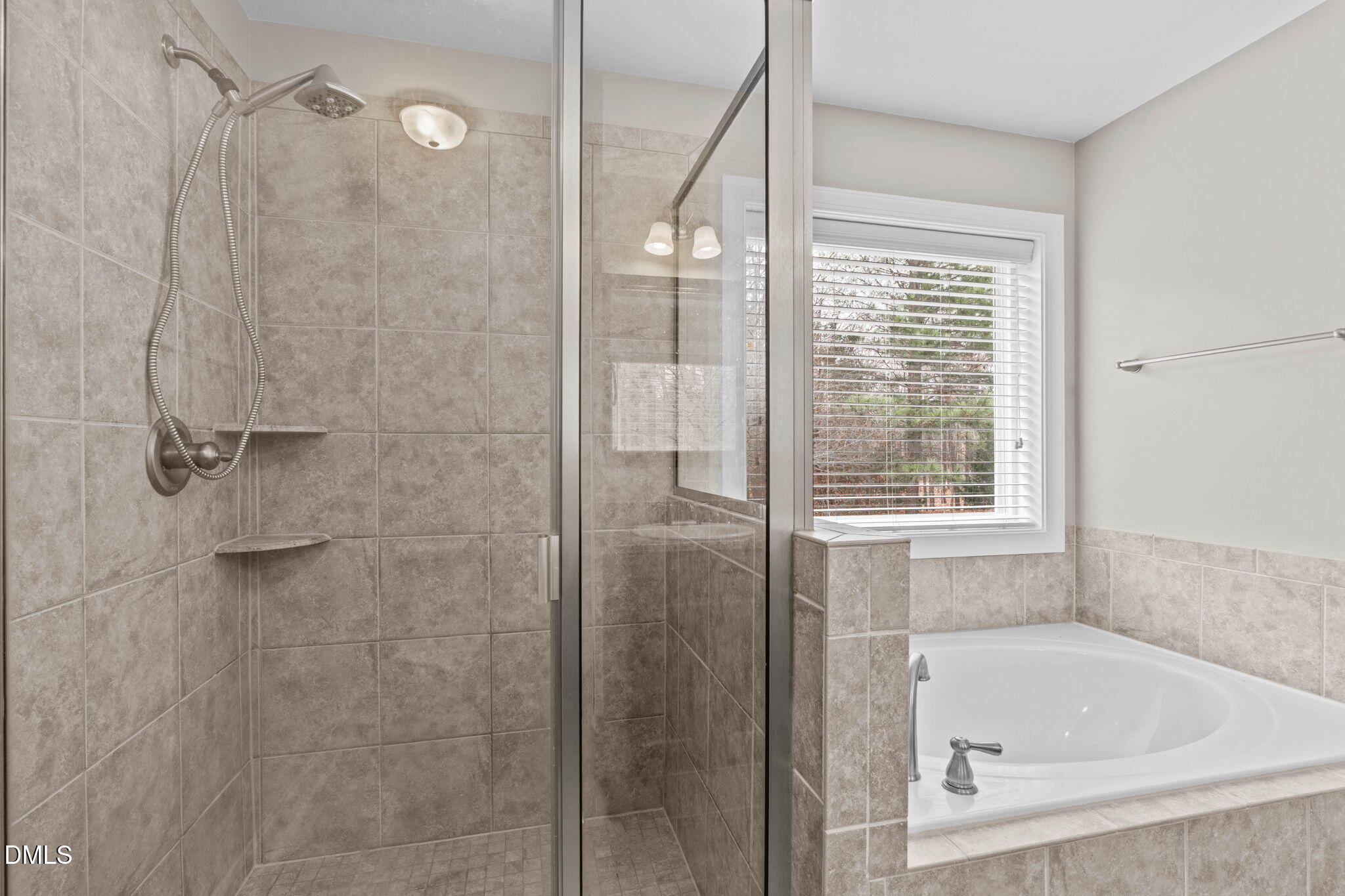 2844 Bogle Branch Court Raleigh, NC 27606 - Photo 28 of 54 a bathroom with a tub shower and a sink