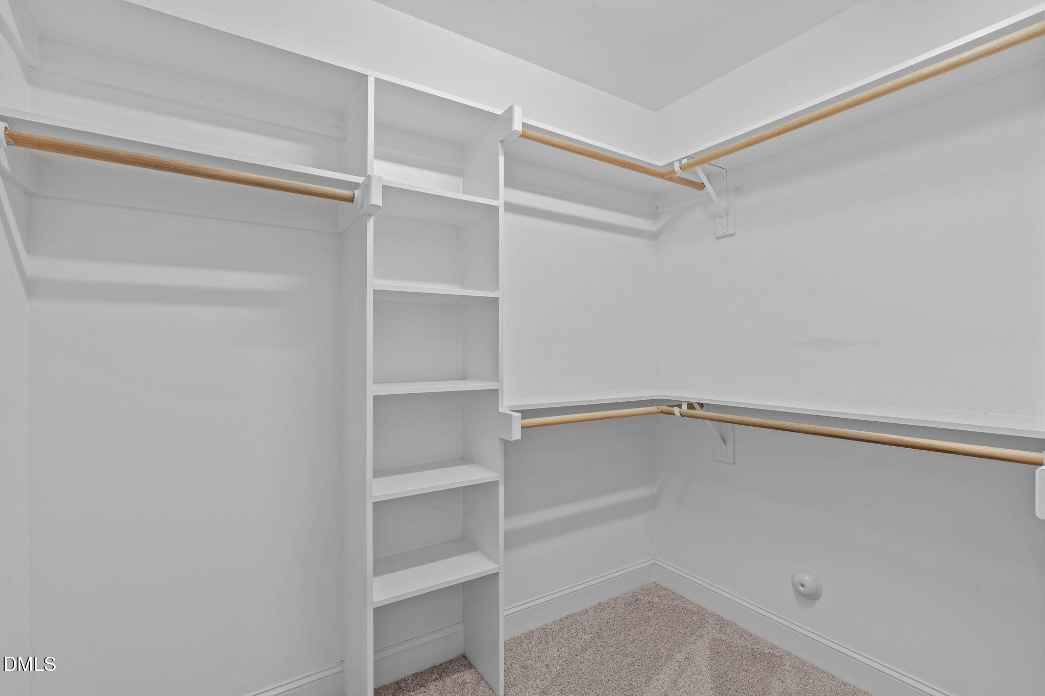 2844 Bogle Branch Court Raleigh, NC 27606 - Photo 31 of 54 a view of walk in closet with empty racks