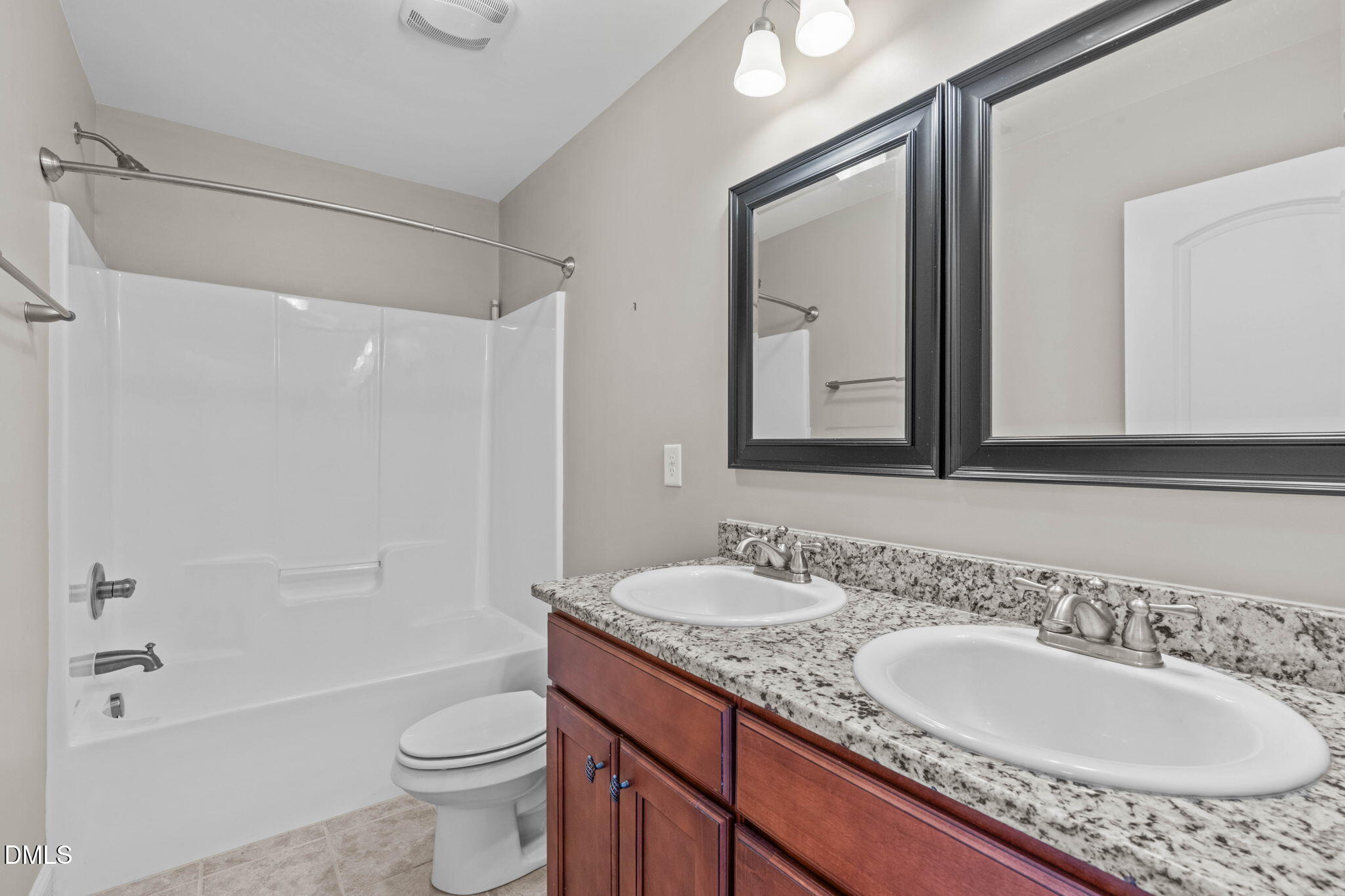 2844 Bogle Branch Court Raleigh, NC 27606 - Photo 35 of 54 a bathroom with a granite countertop sink mirror toilet and bathtub