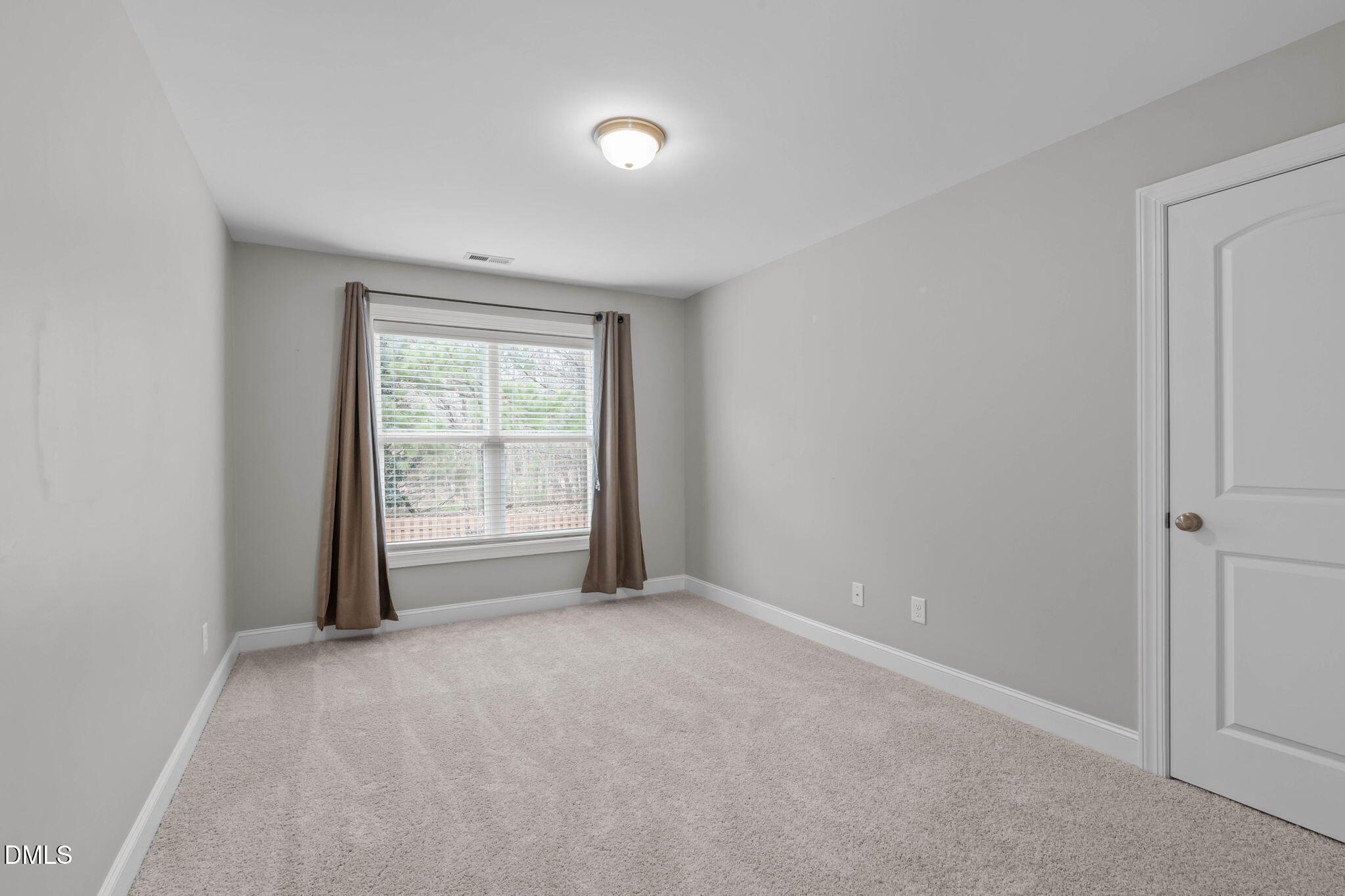 2844 Bogle Branch Court Raleigh, NC 27606 - Photo 37 of 54 a view of an empty room with a window