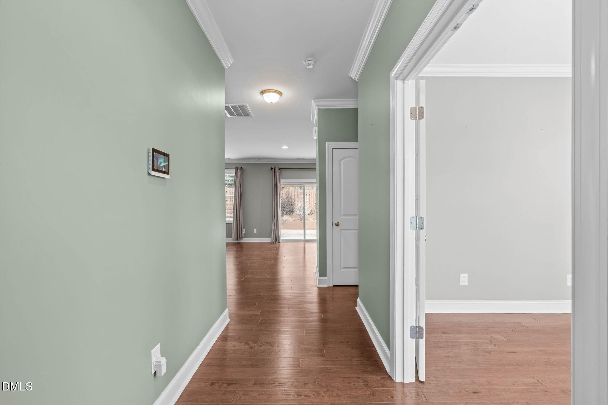 2844 Bogle Branch Court Raleigh, NC 27606 - Photo 5 of 54 a view of a hallway with a wooden floor