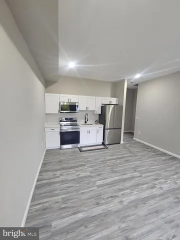 a view of kitchen and wooden floor