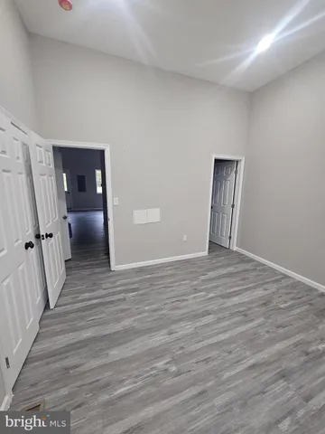 a view of a livingroom with wooden floor
