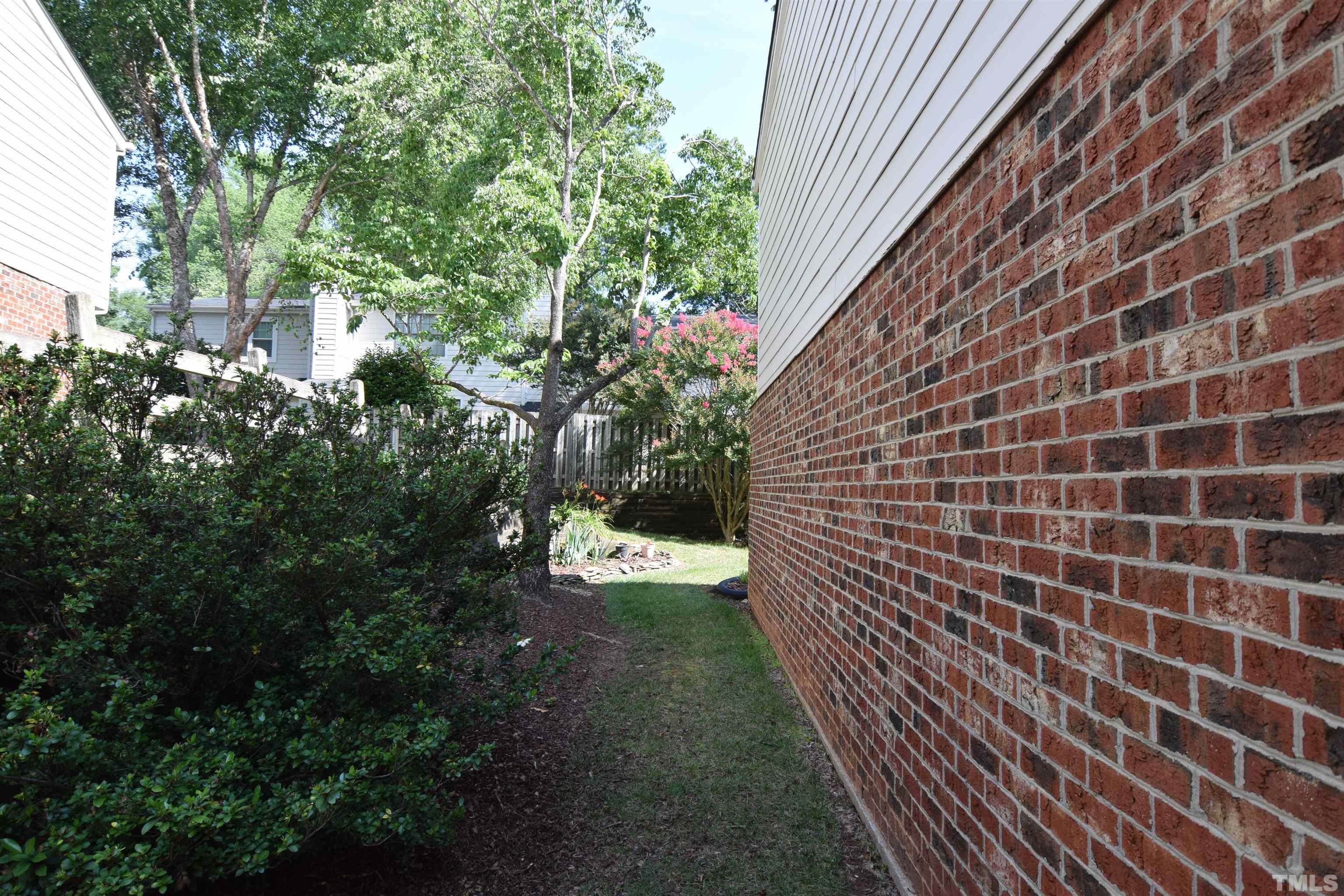 2408 Condor Court, Unit 2408 Raleigh, NC 27615 - Photo 4 of 22 a view of a pathway both side of building