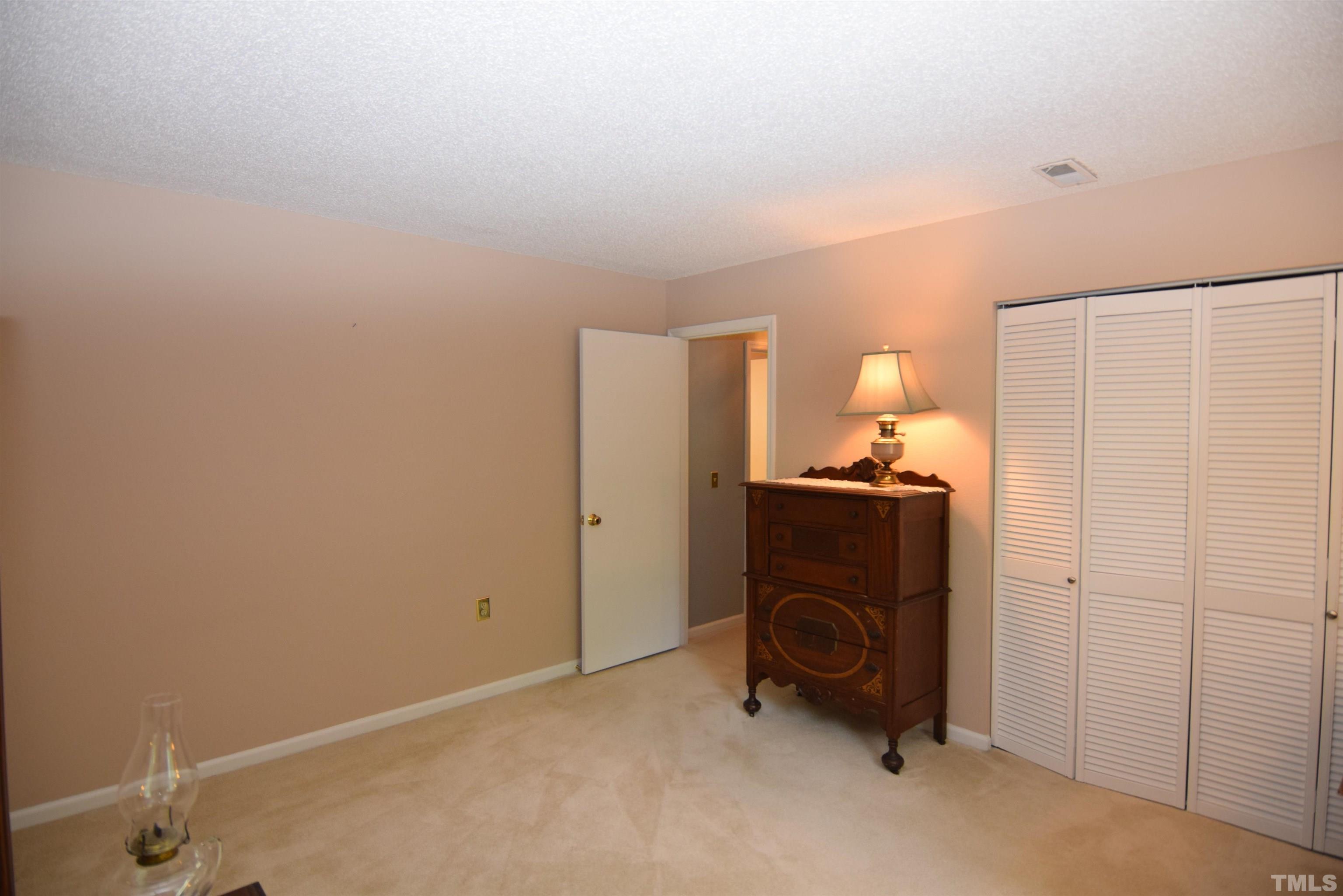2408 Condor Court, Unit 2408 Raleigh, NC 27615 - Photo 8 of 22 a view of a bedroom